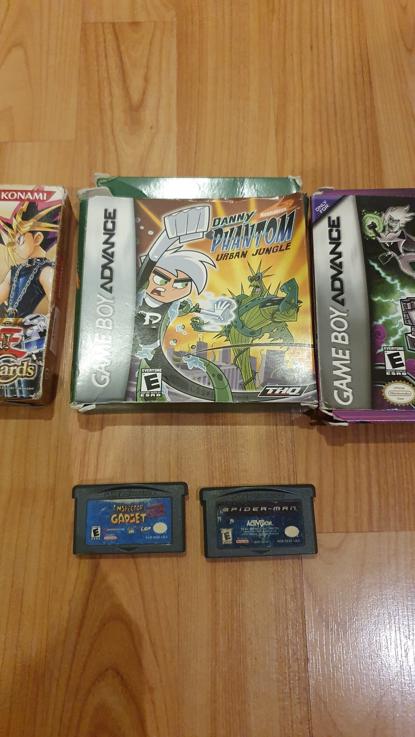 Lot of 5 original Gameboy games in excellent condition: 3 in a box, a Yugioh game in a box, 2 Danny Phantom games in a box, and 2 cartridges (1 Spiderman and Inspector Gadget) - Used.