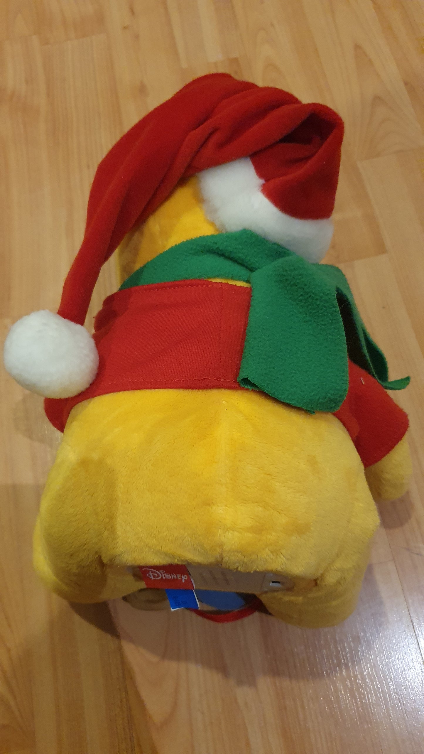 Original Disney Winnie the Pooh Christmas plush with movement and music. Never been used.