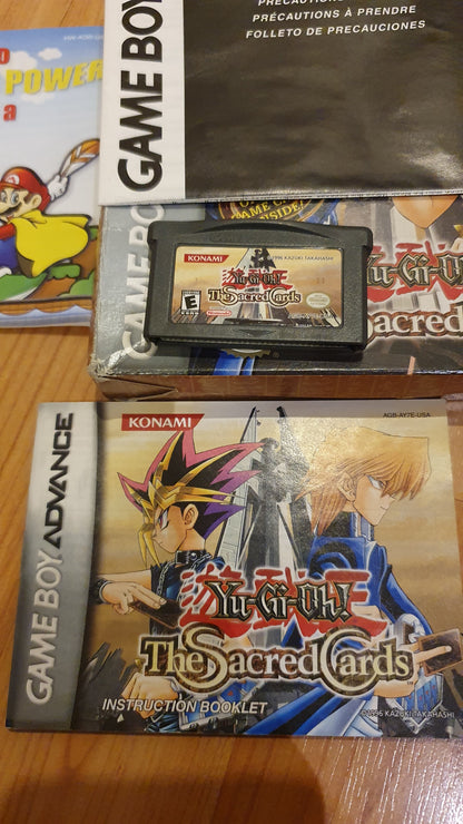 Lot of 5 original Gameboy games in excellent condition: 3 in a box, a Yugioh game in a box, 2 Danny Phantom games in a box, and 2 cartridges (1 Spiderman and Inspector Gadget) - Used.